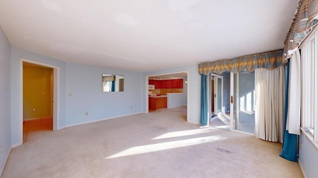 empty room featuring light carpet