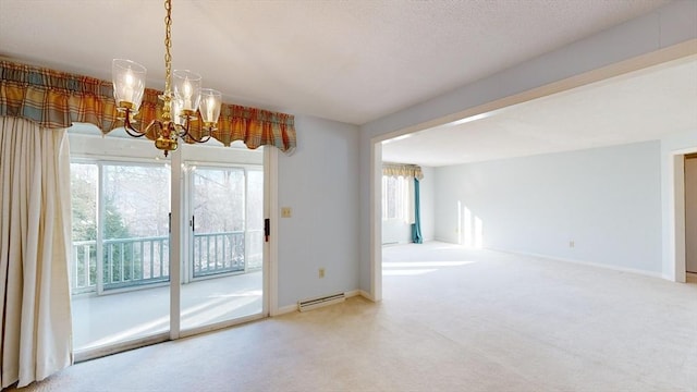 interior space with a baseboard heating unit and a chandelier