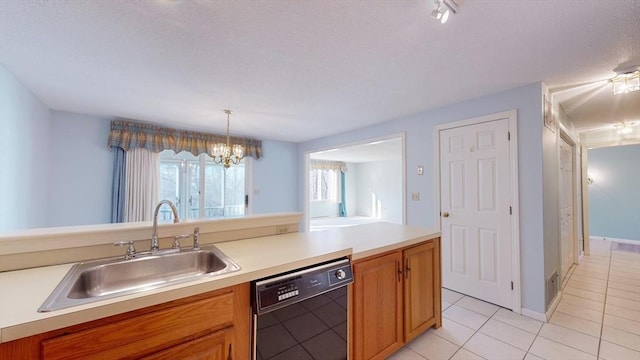 kitchen with sink, a chandelier, hanging light fixtures, light tile patterned floors, and black dishwasher