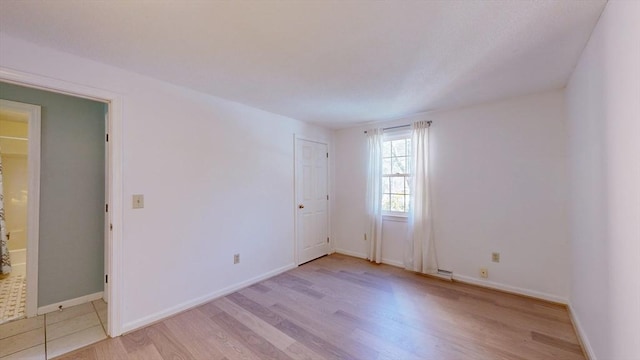 empty room featuring light hardwood / wood-style floors