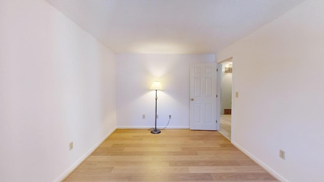 spare room with light wood-type flooring