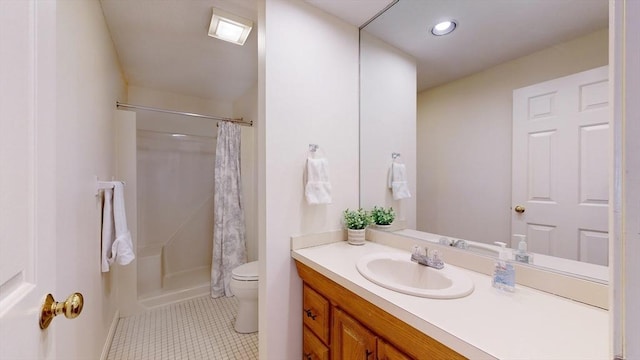 bathroom featuring a shower with curtain, vanity, tile patterned floors, and toilet