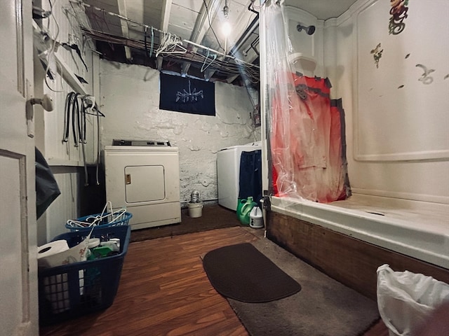 interior space with dark wood-type flooring and washer and clothes dryer