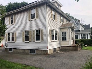 back of property with a patio