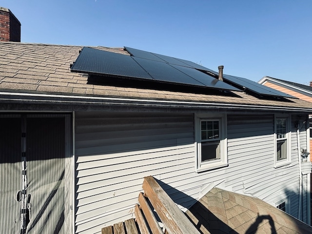 view of home's exterior featuring solar panels