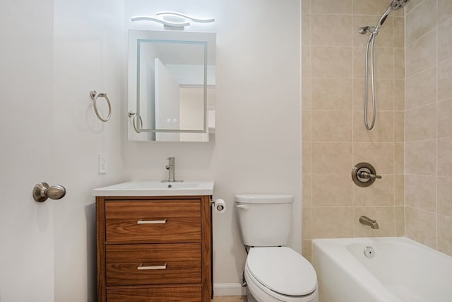 full bathroom featuring tiled shower / bath combo, vanity, and toilet