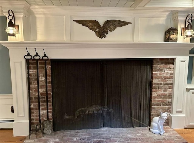 14 Alderbrook Dr, Topsfield, MA 01983 - detailed view of ornamental molding, a baseboard heating unit, and wood finished floors