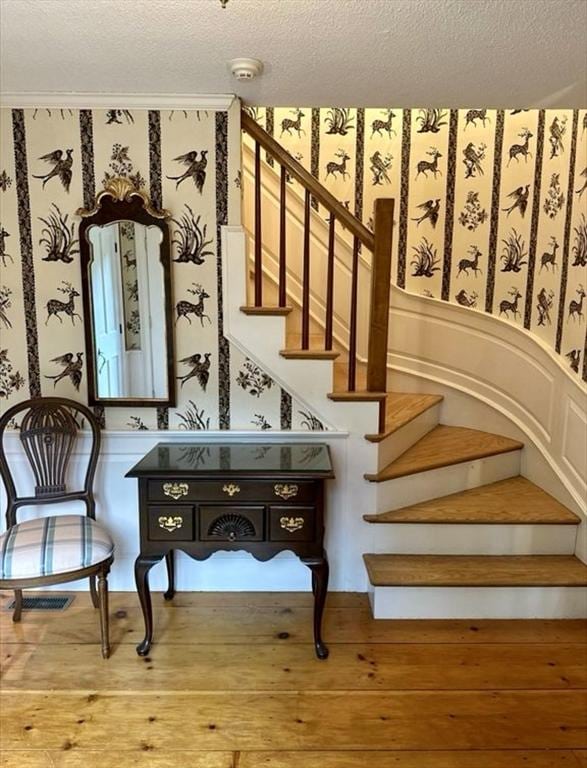 14 Alderbrook Dr, Topsfield, MA 01983 - stairway with wallpapered walls, a textured ceiling, and wood finished floors