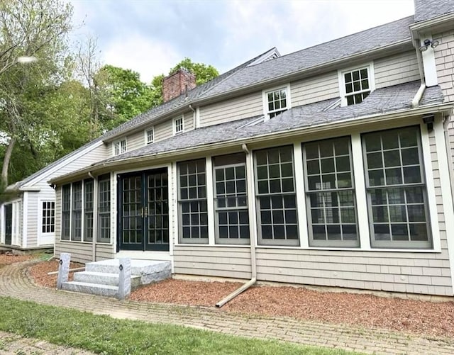 14 Alderbrook Dr, Topsfield, MA 01983 - rear view of property featuring a sunroom, a chimney, and entry steps