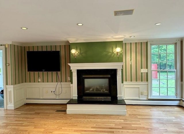 14 Alderbrook Dr, Topsfield, MA 01983 - unfurnished living room featuring wallpapered walls, a baseboard heating unit, a baseboard radiator, ornamental molding, and wood finished floors