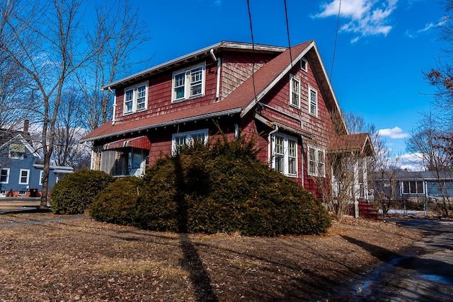 view of front of home featuring a shingled roof