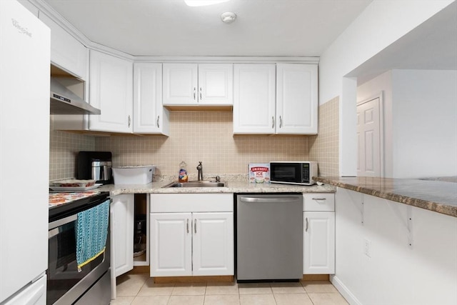 9 Tara Dr Unit 8, Weymouth, MA 02188 - kitchen featuring stainless steel appliances, a sink, white cabinetry, and light tile patterned floors