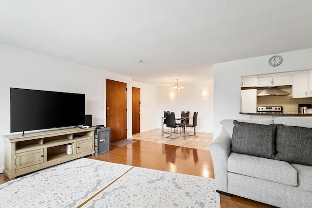 9 Tara Dr Unit 8, Weymouth, MA 02188 - living area with wood finished floors and a chandelier