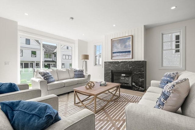 2 Collier Rd, Scituate, MA 02066 - living area with a fireplace, light wood-style floors, and recessed lighting