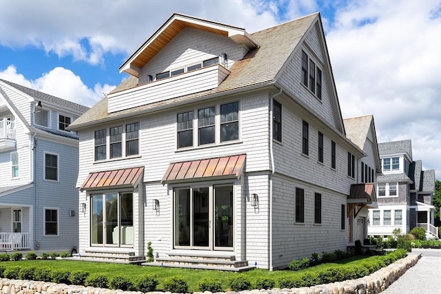 2 Collier Rd, Scituate, MA 02066 - back of house with entry steps, a standing seam roof, and metal roof