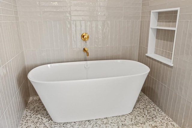 2 Collier Rd, Scituate, MA 02066 - full bathroom with tile walls, a soaking tub, and tile patterned floors
