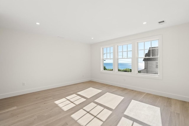 2 Collier Rd, Scituate, MA 02066 - empty room with light wood-style flooring, baseboards, and recessed lighting