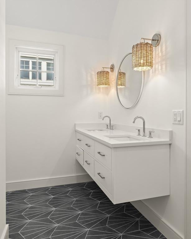 2 Collier Rd, Scituate, MA 02066 - bathroom with baseboards and double vanity