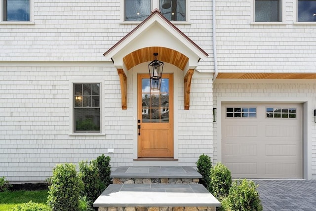 2 Collier Rd, Scituate, MA 02066 - doorway to property featuring an attached garage