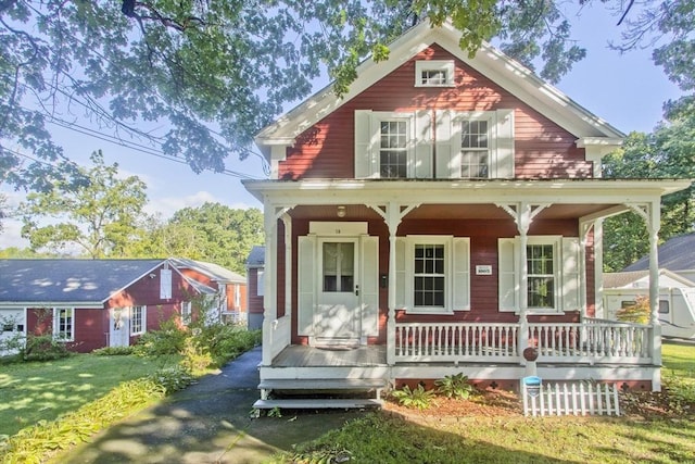 view of front facade featuring a porch and a front yard
