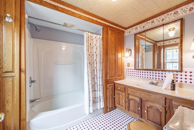 full bath with shower / bathtub combination with curtain, vanity, and tasteful backsplash