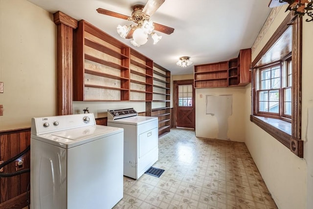 clothes washing area featuring separate washer and dryer, light flooring, and ceiling fan
