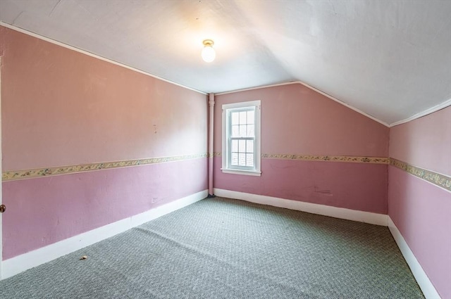 bonus room with carpet, vaulted ceiling, and baseboards