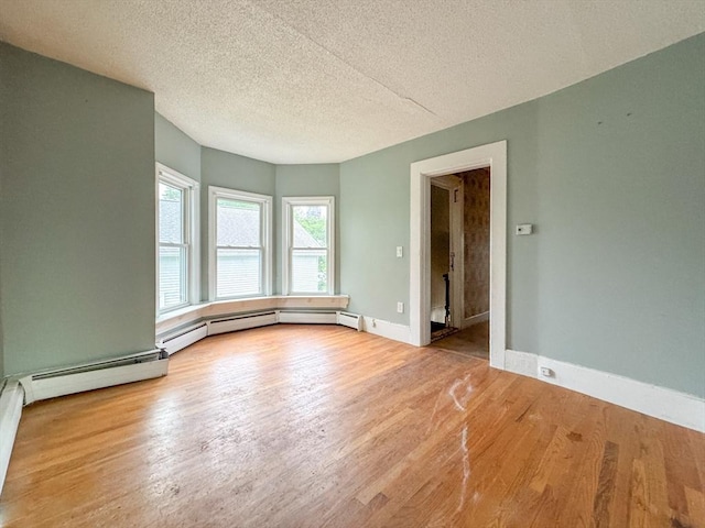 66 Taylor St, Holyoke, MA 01040 - unfurnished room featuring wood finished floors, a textured ceiling, and baseboards