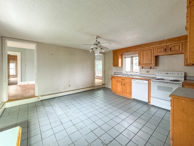 66 Taylor St, Holyoke, MA 01040 - kitchen with white appliances, a baseboard radiator, ceiling fan, a sink, and a textured ceiling