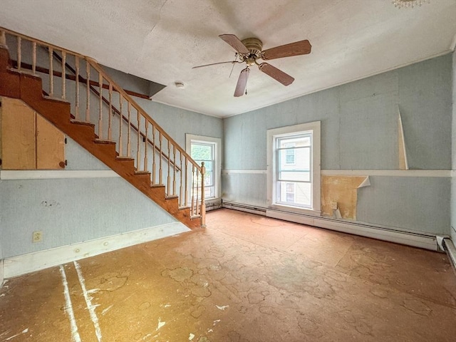66 Taylor St, Holyoke, MA 01040 - unfurnished living room featuring stairs, ceiling fan, a baseboard heating unit, a textured ceiling, and baseboards