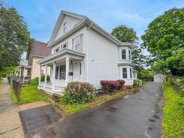 66 Taylor St, Holyoke, MA 01040 - view of front of home with covered porch and an outbuilding