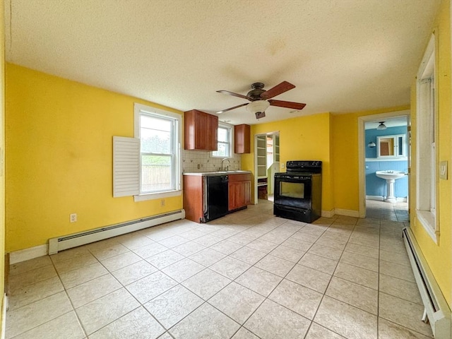 66 Taylor St, Holyoke, MA 01040 - kitchen featuring black appliances, baseboard heating, a baseboard radiator, ceiling fan, and light tile patterned flooring