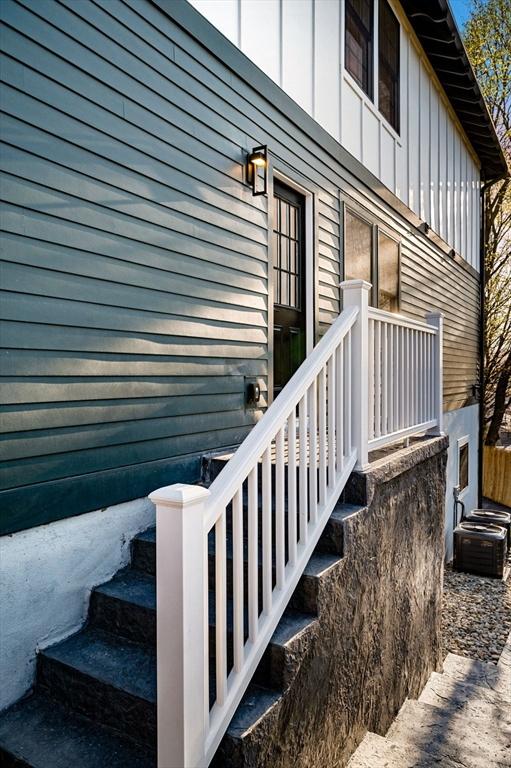 238 Bellevue St Unit 2, Newton, MA 02458 - doorway to property featuring cooling unit and board and batten siding