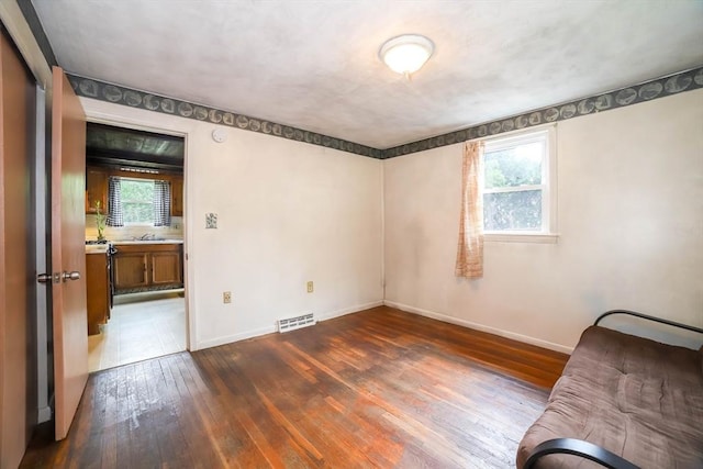 213 Nashua Rd, Billerica, MA 01862 - unfurnished bedroom featuring dark wood-type flooring and baseboards