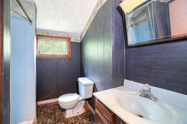 213 Nashua Rd, Billerica, MA 01862 - bathroom with vanity, a textured ceiling, and a shower