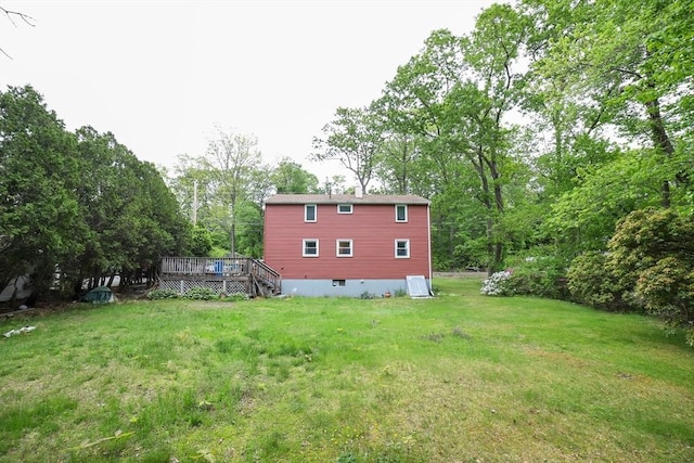 213 Nashua Rd, Billerica, MA 01862 - view of grassy yard featuring a deck and view of scattered trees