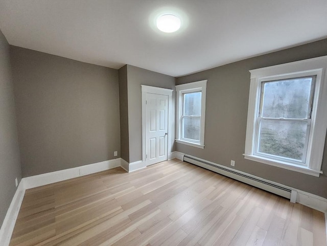 97-99 Blaisdell St Unit 1, Haverhill, MA 01832 - unfurnished bedroom featuring light wood finished floors, multiple windows, and baseboards