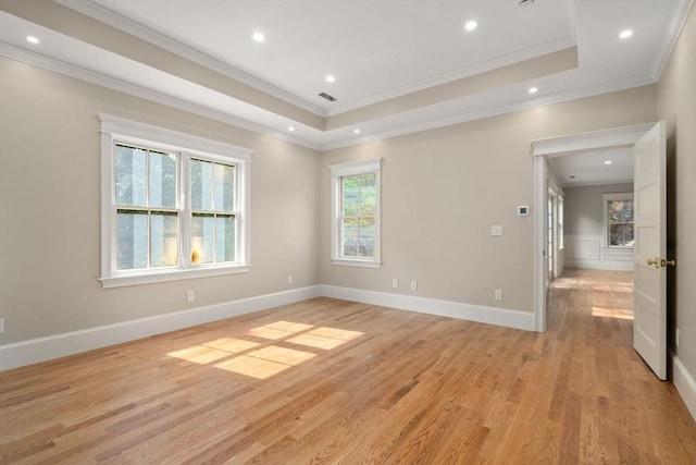 23 Francis Unit 23, Newton, MA 02459 - spare room featuring crown molding, light wood-style floors, recessed lighting, a tray ceiling, and baseboards
