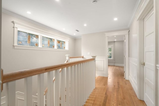 23 Francis Unit 23, Newton, MA 02459 - corridor featuring light wood-style floors, an upstairs landing, recessed lighting, wainscoting, and a decorative wall