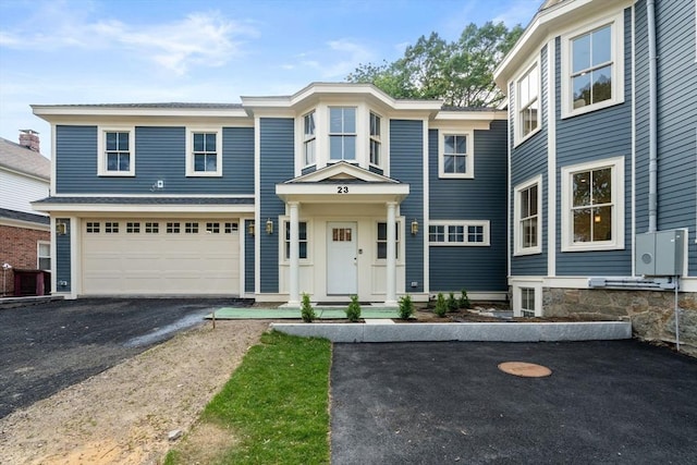 23 Francis Unit 23, Newton, MA 02459 - view of front of home with asphalt driveway and an attached garage