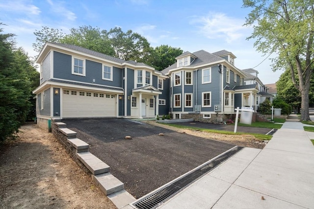 23 Francis Unit 23, Newton, MA 02459 - view of front of home featuring a garage and driveway