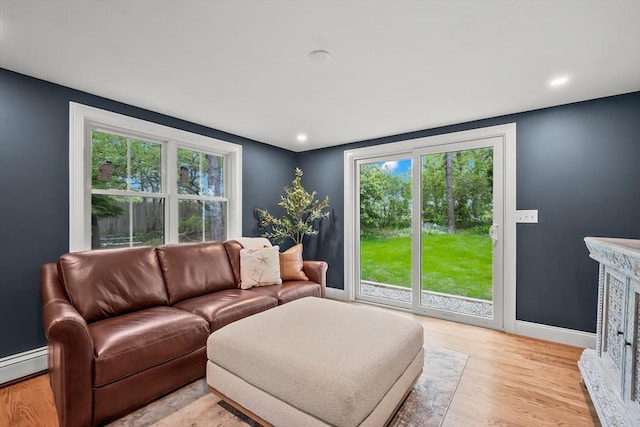 3 Laurie, Harwich, MA 02646 - living area featuring baseboards, baseboard heating, light wood-type flooring, and recessed lighting