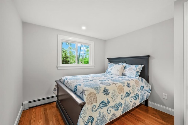 3 Laurie, Harwich, MA 02646 - bedroom featuring a baseboard radiator, baseboards, wood finished floors, and recessed lighting