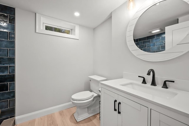 3 Laurie, Harwich, MA 02646 - bathroom featuring wood finished floors, vanity, toilet, baseboards, and tiled shower