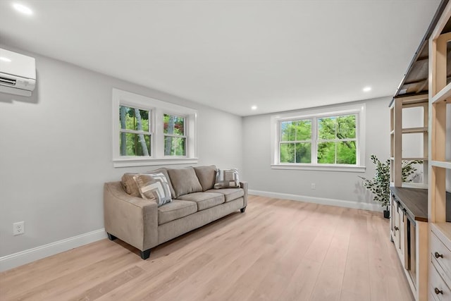 3 Laurie, Harwich, MA 02646 - living room featuring light wood finished floors, baseboards, a wall mounted AC, and recessed lighting