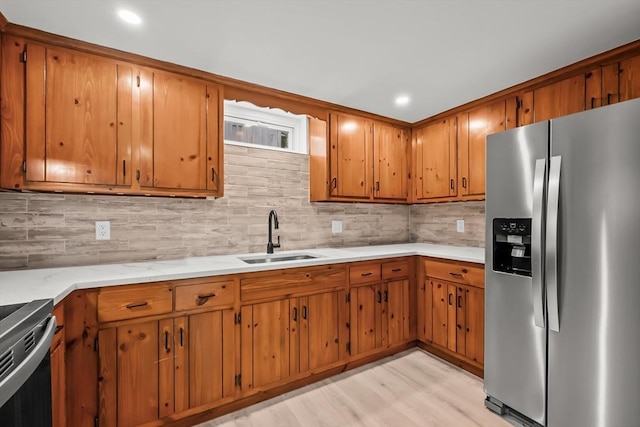 3 Laurie, Harwich, MA 02646 - kitchen with stainless steel fridge with ice dispenser, a sink, brown cabinets, backsplash, and recessed lighting