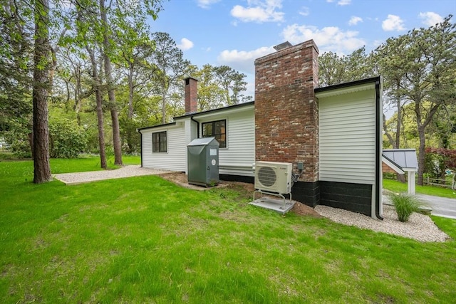 3 Laurie, Harwich, MA 02646 - back of property with a chimney, a cooling unit, and a yard