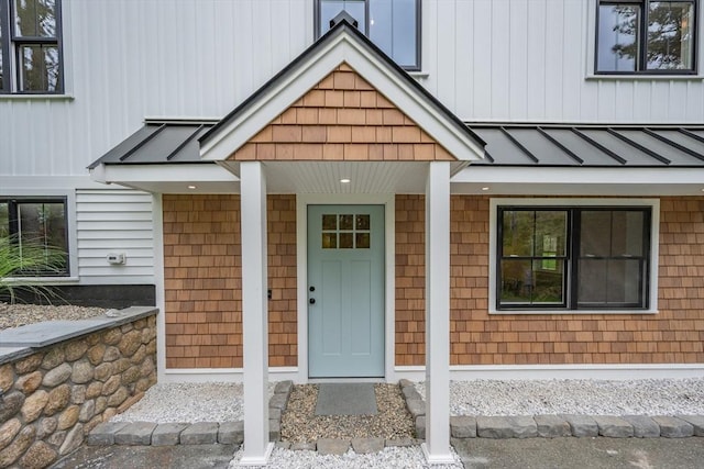 3 Laurie, Harwich, MA 02646 - view of exterior entry featuring a standing seam roof, board and batten siding, metal roof, and covered porch