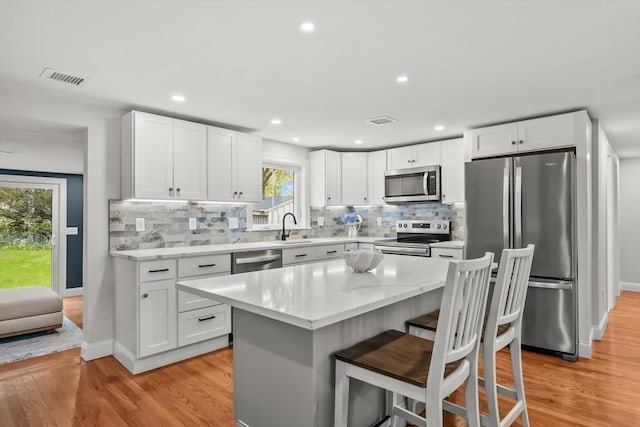 3 Laurie, Harwich, MA 02646 - kitchen with appliances with stainless steel finishes, a sink, light wood-style floors, and recessed lighting