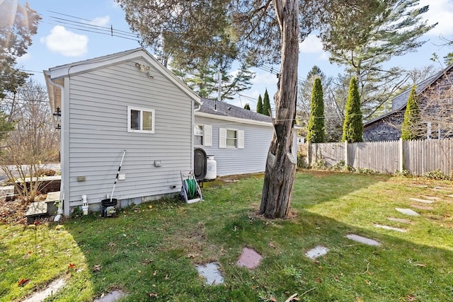 rear view of house featuring a yard